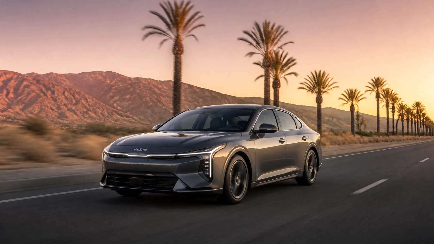 2026 Kia K4 driving through Palm Desert at sunset